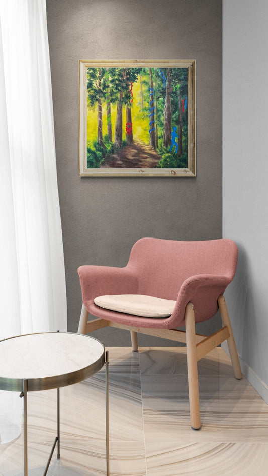 A mystical woodland oil painting with a blue spirit figure, displayed above a chic pink armchair for size and scale