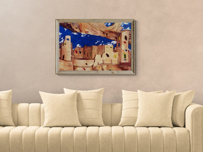 Surrealist Southwestern pueblo painting displayed framed on the wall.above a beige sofa for scale and size.