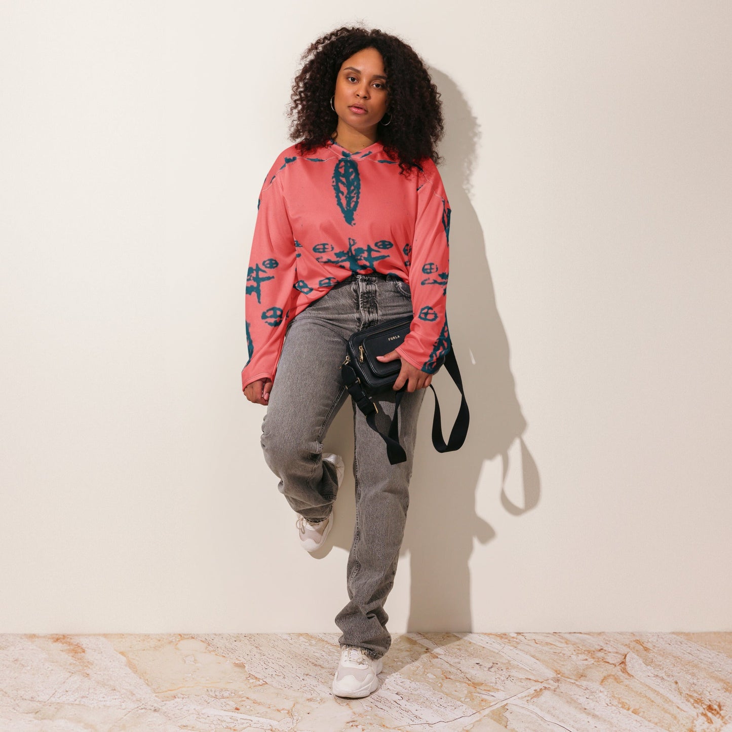 The recycled hockey fan jersey designed by Delaney Henderson and crafted from a artistic design using mystical symbols.