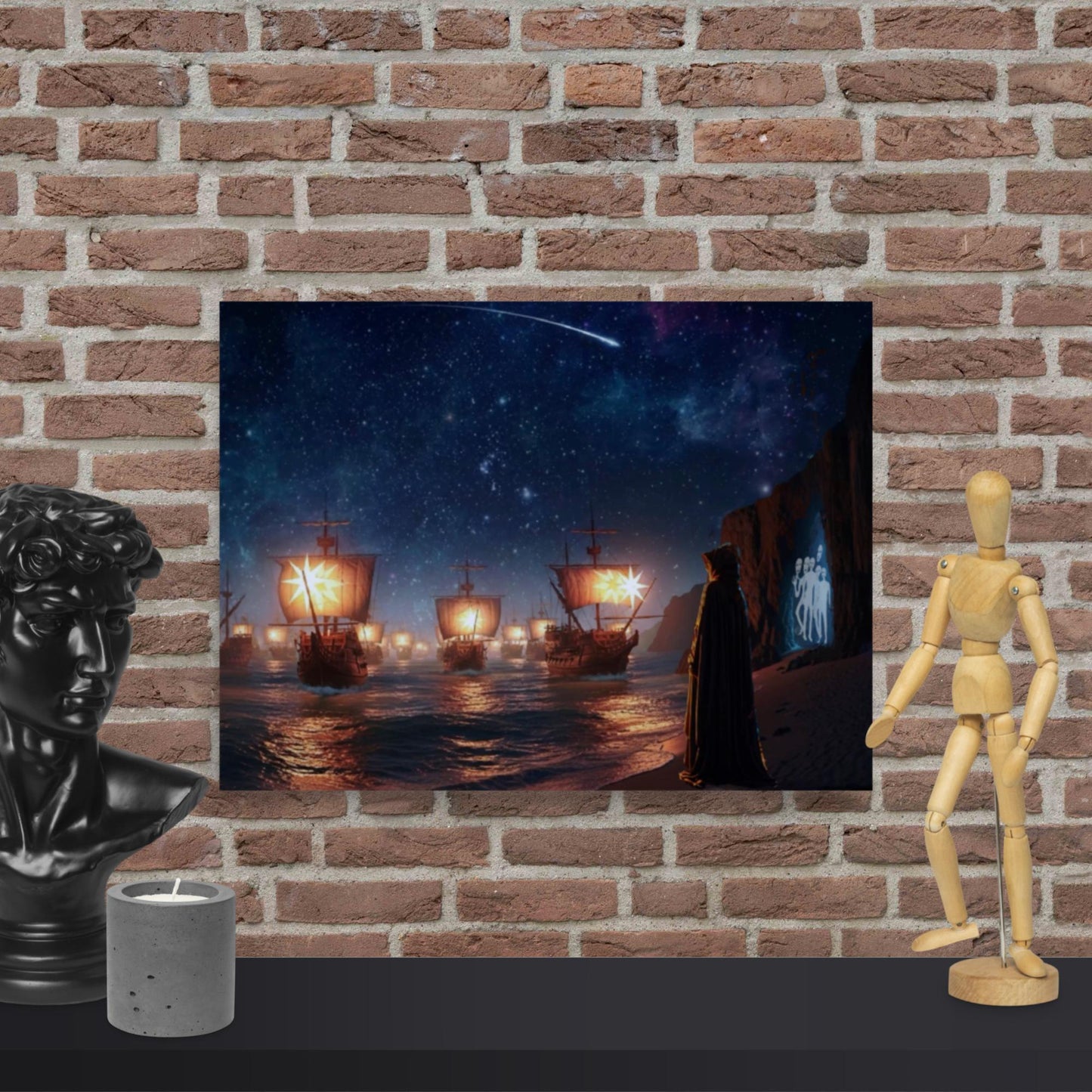 The Armada cosmic fantasy wall art print featuring glowing sailing ships, shooting star night sky, and mysterious hooded figure displayed with a mannequin and candle on a brick wall background