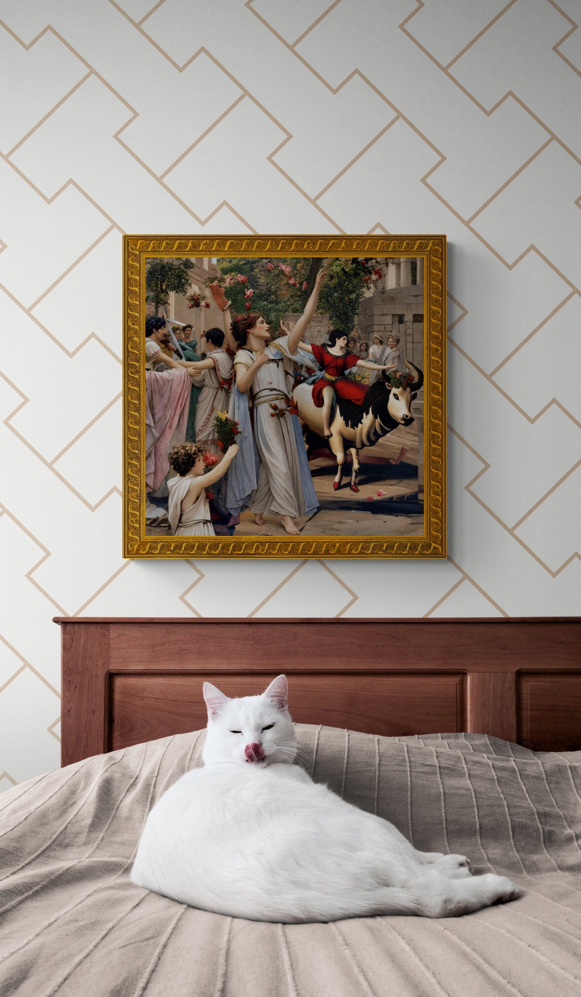 Classical mythology art print of a festival and flower-garlanded bull, framed on a wall above a cat on a bed.